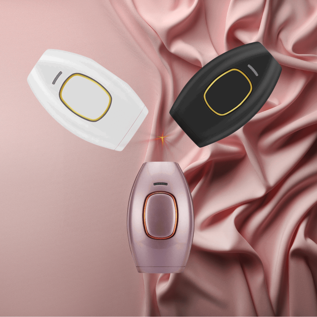 Three IPL hair care device on a pink fabric background