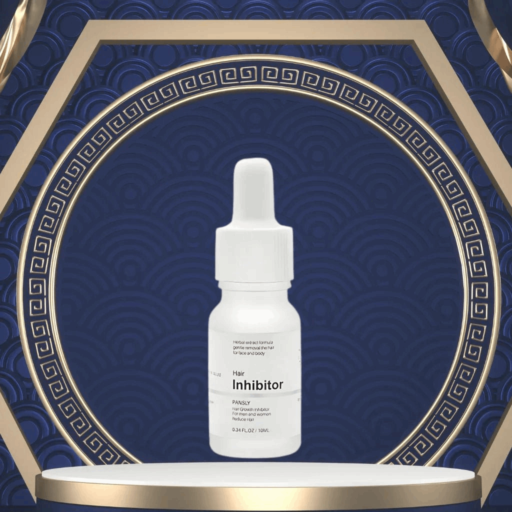 White bottle labeled 'Hair Inhibitor' on a decorative blue and gold background